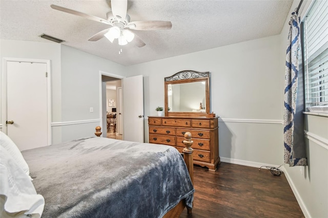 4108 Woodtrail Blvd, New Port Richey, FL 34653 - bedroom featuring wood finished floors, a textured ceiling, and a ceiling fan