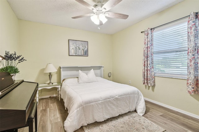 4108 Woodtrail Blvd, New Port Richey, FL 34653 - bedroom featuring wood finished floors and a ceiling fan