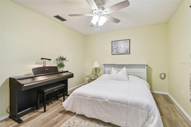 4108 Woodtrail Blvd, New Port Richey, FL 34653 - bedroom with wood finished floors and ceiling fan