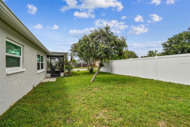 4108 Woodtrail Blvd, New Port Richey, FL 34653 - fenced backyard featuring a sunroom