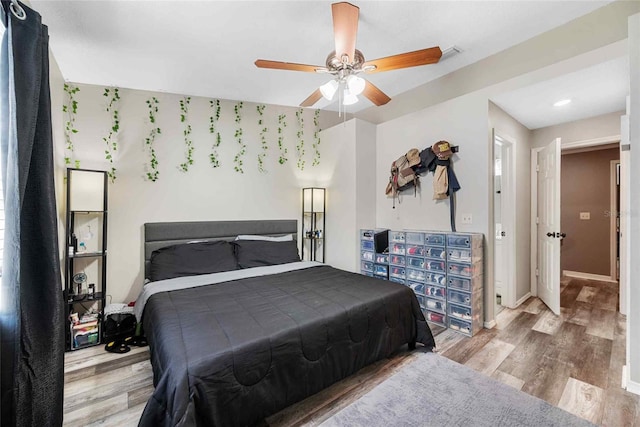 3350 Fox Hunt Dr, Palm Harbor, FL 34683 - bedroom featuring wood finished floors, recessed lighting, and a ceiling fan