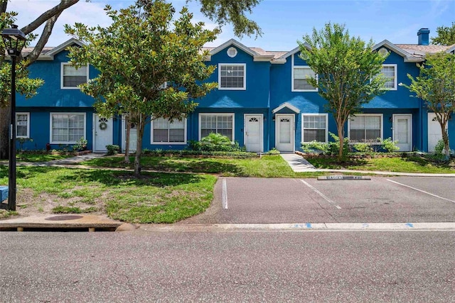 3350 Fox Hunt Dr, Palm Harbor, FL 34683 - multi unit property featuring uncovered parking and stucco siding