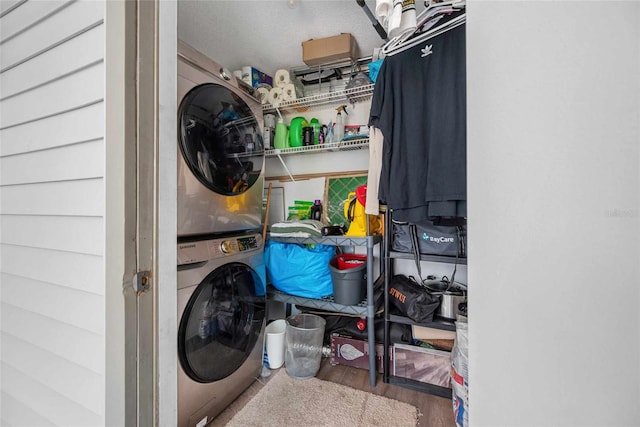 3350 Fox Hunt Dr, Palm Harbor, FL 34683 - washroom with stacked washer / drying machine and wood finished floors