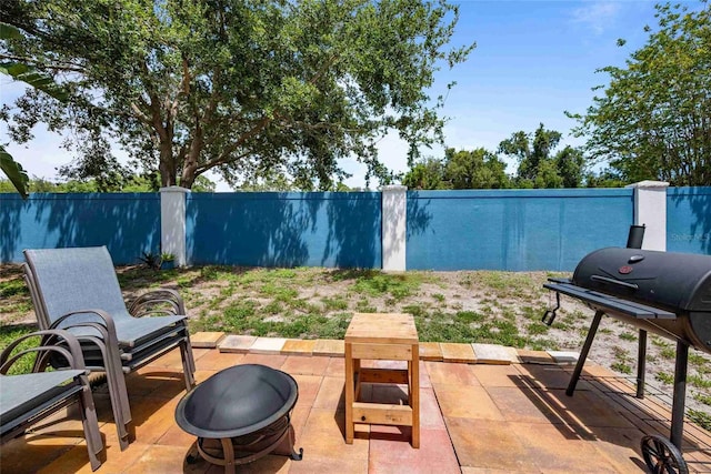 3350 Fox Hunt Dr, Palm Harbor, FL 34683 - view of patio / terrace with an outdoor fire pit and grilling area