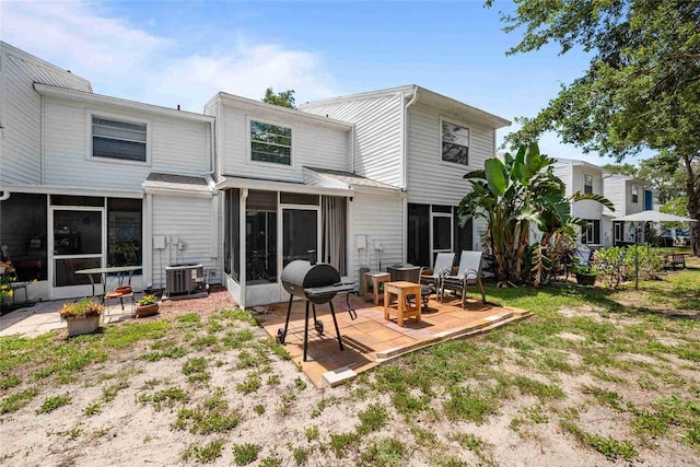 3350 Fox Hunt Dr, Palm Harbor, FL 34683 - back of house featuring a sunroom and a patio