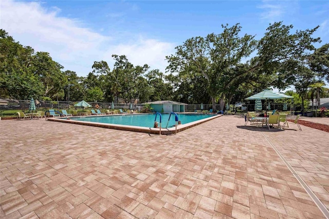 3350 Fox Hunt Dr, Palm Harbor, FL 34683 - community pool with a patio area