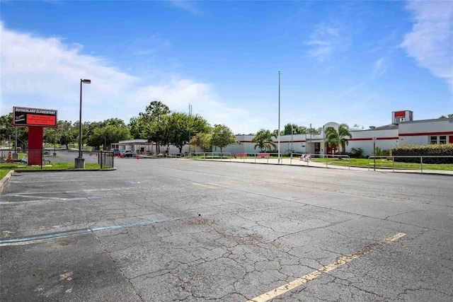 3350 Fox Hunt Dr, Palm Harbor, FL 34683 - view of asphalt road with curbs and street lights