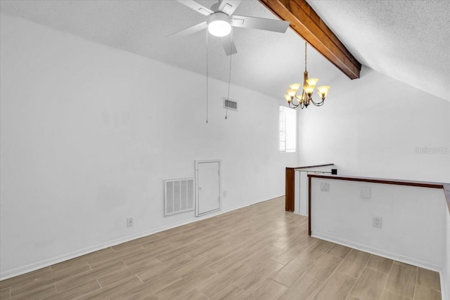 7811 Niagara Ave Unit 2125, Tampa, FL 33617 - unfurnished room with a chandelier, light wood finished floors, a ceiling fan, and a textured ceiling