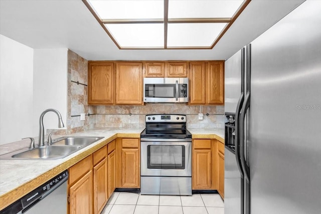 7811 Niagara Ave Unit 2125, Tampa, FL 33617 - kitchen with appliances with stainless steel finishes, light countertops, and tasteful backsplash