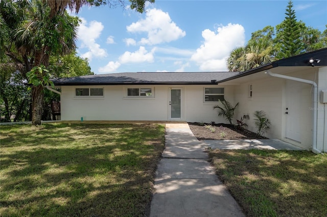 6108 Oak Ridge Ave, New Port Richey, FL 34653 - ranch-style house with a front lawn