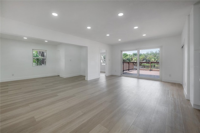 6108 Oak Ridge Ave, New Port Richey, FL 34653 - empty room featuring healthy amount of natural light, recessed lighting, and light wood-style flooring