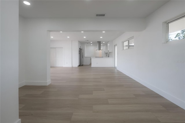 6108 Oak Ridge Ave, New Port Richey, FL 34653 - hall with recessed lighting and light wood finished floors