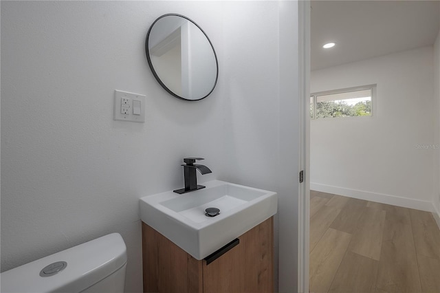 6108 Oak Ridge Ave, New Port Richey, FL 34653 - half bathroom with wood finished floors, vanity, and recessed lighting