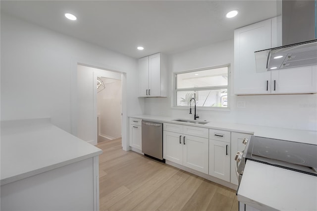 6108 Oak Ridge Ave, New Port Richey, FL 34653 - kitchen with appliances with stainless steel finishes, wall chimney exhaust hood, light wood-style flooring, white cabinets, and recessed lighting
