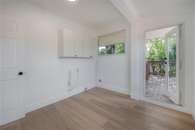 6108 Oak Ridge Ave, New Port Richey, FL 34653 - washroom with plenty of natural light, light wood-style flooring, and cabinet space
