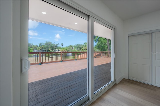 6108 Oak Ridge Ave, New Port Richey, FL 34653 - doorway featuring light wood-type flooring and recessed lighting