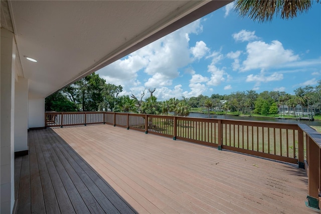 6108 Oak Ridge Ave, New Port Richey, FL 34653 - wooden deck featuring a water view and view of scattered trees