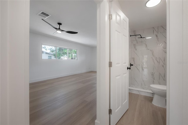 6108 Oak Ridge Ave, New Port Richey, FL 34653 - full bath featuring a marble finish shower, wood finished floors, and ceiling fan