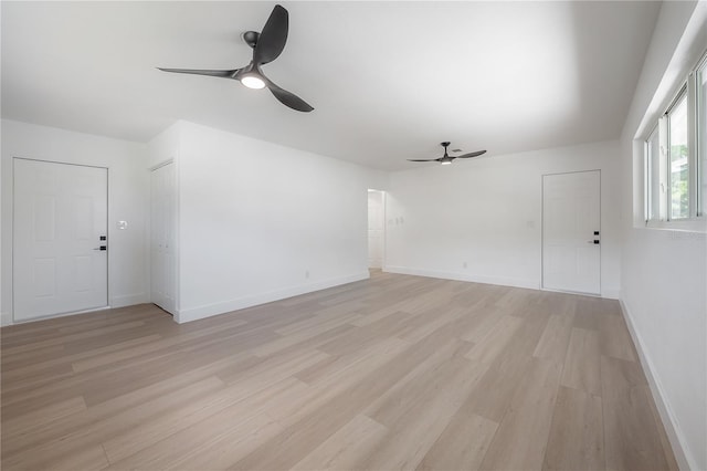 6108 Oak Ridge Ave, New Port Richey, FL 34653 - unfurnished living room with ceiling fan and light wood-style flooring