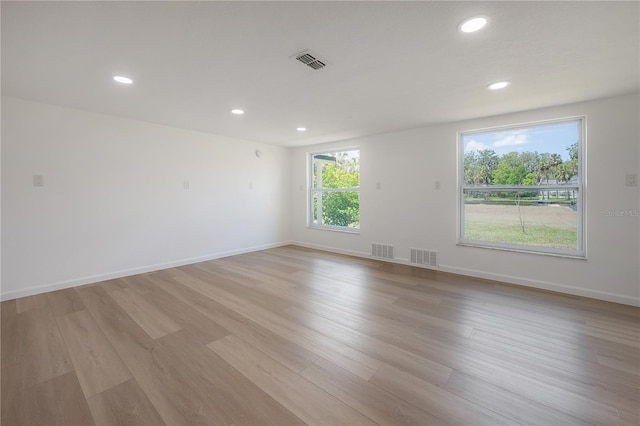 6108 Oak Ridge Ave, New Port Richey, FL 34653 - empty room with recessed lighting and light wood-style floors