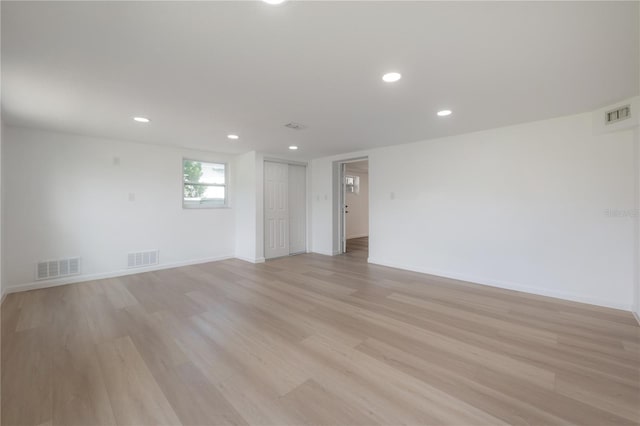 6108 Oak Ridge Ave, New Port Richey, FL 34653 - empty room with light wood-style flooring and recessed lighting