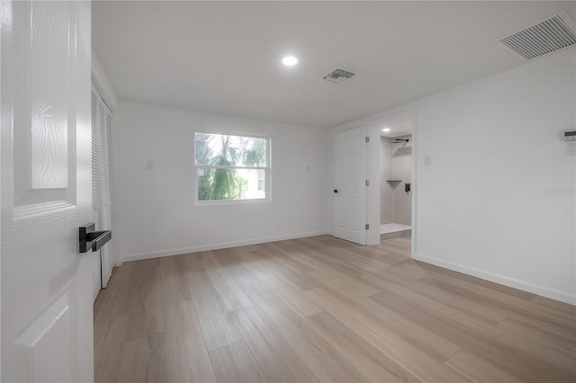 6108 Oak Ridge Ave, New Port Richey, FL 34653 - empty room with light wood-style floors and recessed lighting