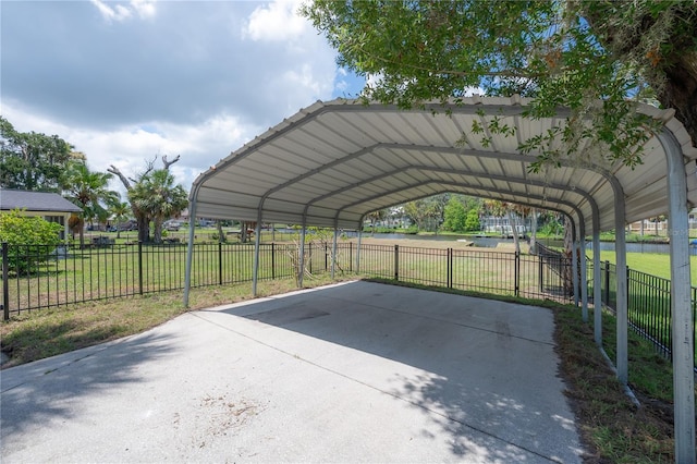 6108 Oak Ridge Ave, New Port Richey, FL 34653 - view of car parking featuring a carport and concrete driveway