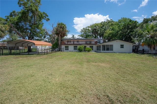 6108 Oak Ridge Ave, New Port Richey, FL 34653 - fenced backyard featuring a detached carport and a sunroom