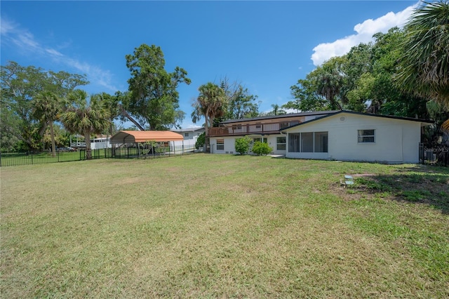 6108 Oak Ridge Ave, New Port Richey, FL 34653 - fenced backyard featuring a carport and a sunroom