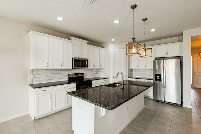 13408 Nimble Minke Unit 155E, Riverview, FL 33579 - kitchen featuring appliances with stainless steel finishes, tasteful backsplash, light tile patterned floors, white cabinets, and recessed lighting