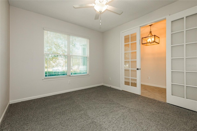 13408 Nimble Minke Unit 155E, Riverview, FL 33579 - spare room with carpet flooring, french doors, a chandelier, and ceiling fan