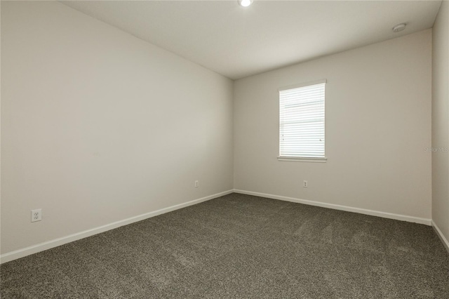 13408 Nimble Minke Unit 155E, Riverview, FL 33579 - empty room with dark colored carpet and a smoke detector