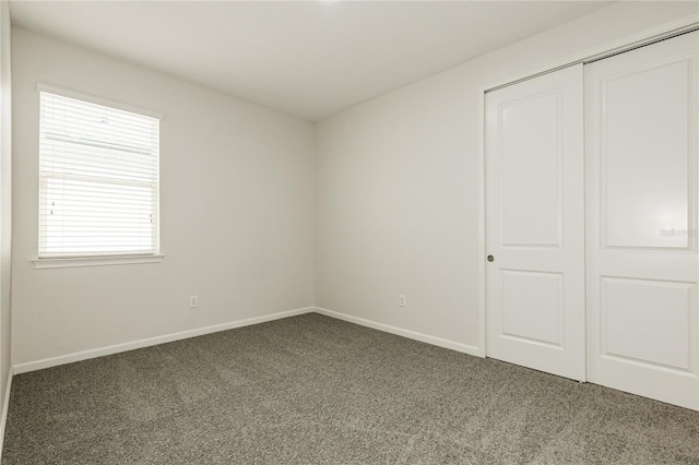 13408 Nimble Minke Unit 155E, Riverview, FL 33579 - unfurnished bedroom featuring carpet floors and a closet