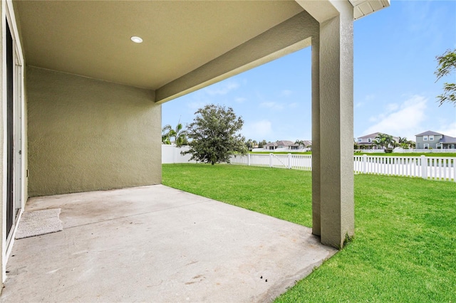 13408 Nimble Minke Unit 155E, Riverview, FL 33579 - fenced backyard featuring a patio, a residential view, and a water view