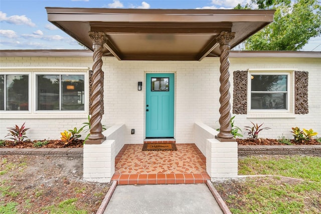5934 51st Ave N, Kenneth City, FL 33709 - doorway to property with brick siding
