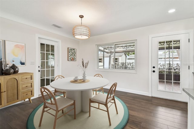 5934 51st Ave N, Kenneth City, FL 33709 - dining space featuring plenty of natural light, dark wood-type flooring, and recessed lighting