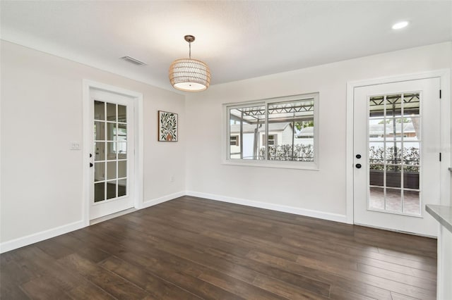 5934 51st Ave N, Kenneth City, FL 33709 - unfurnished dining area with healthy amount of natural light, dark wood-type flooring, and recessed lighting