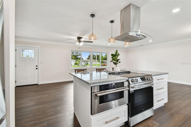 5934 51st Ave N, Kenneth City, FL 33709 - kitchen featuring island range hood, appliances with stainless steel finishes, white cabinets, dark wood-style floors, and recessed lighting