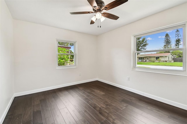 5934 51st Ave N, Kenneth City, FL 33709 - spare room featuring dark wood finished floors and a ceiling fan