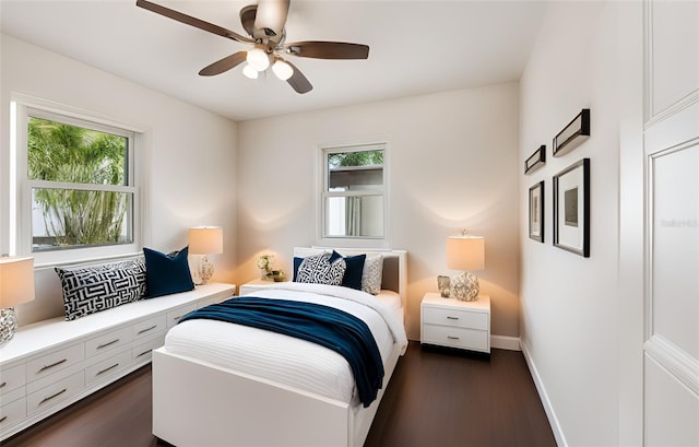 5934 51st Ave N, Kenneth City, FL 33709 - bedroom featuring multiple windows, dark wood-style flooring, and ceiling fan