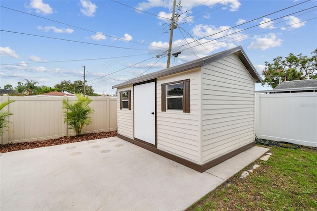 5934 51st Ave N, Kenneth City, FL 33709 - view of outbuilding with a fenced backyard