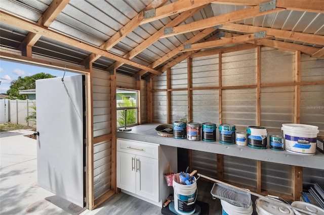 5934 51st Ave N, Kenneth City, FL 33709 - bar featuring lofted ceiling and light wood-style flooring