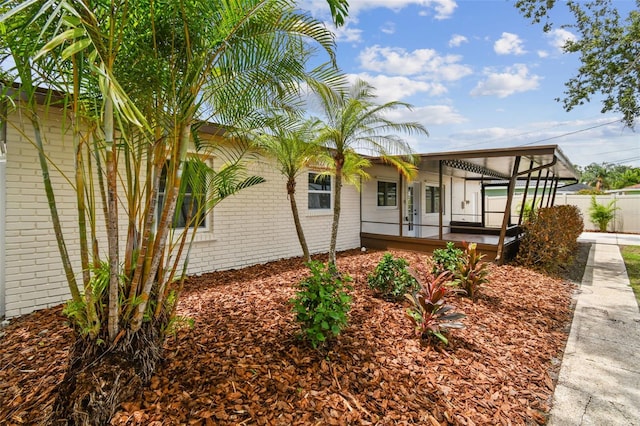 5934 51st Ave N, Kenneth City, FL 33709 - view of front facade with brick siding and covered porch