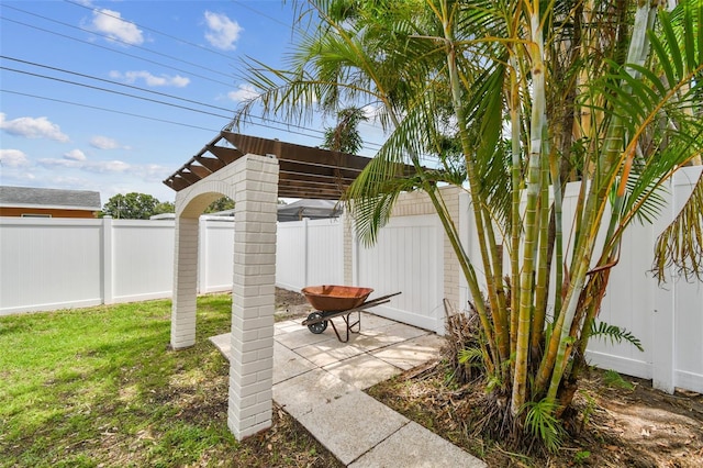 5934 51st Ave N, Kenneth City, FL 33709 - fenced backyard featuring a patio area and a pergola