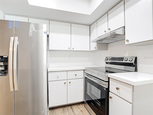 20352 Astoria Ave, Port Charlotte, FL 33952 - kitchen featuring appliances with stainless steel finishes, under cabinet range hood, light countertops, and white cabinetry