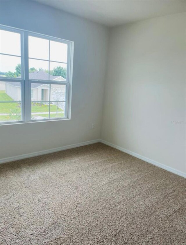 5543 Siltstone St, Lakeland, FL 33811 - unfurnished room with carpet and baseboards