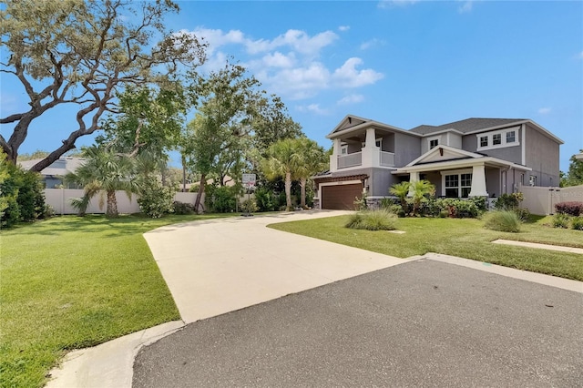 10399 Boyette Brook St, Riverview, FL 33569 - view of front facade with a balcony, an attached garage, driveway, and stucco siding
