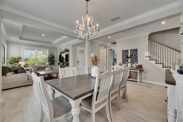 10399 Boyette Brook St, Riverview, FL 33569 - dining room featuring stairway, a chandelier, crown molding, and light wood-style flooring