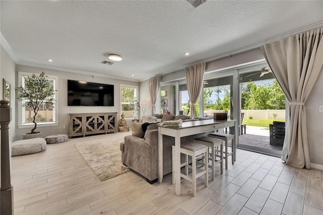 10399 Boyette Brook St, Riverview, FL 33569 - living area featuring crown molding, a textured ceiling, light wood finished floors, and recessed lighting