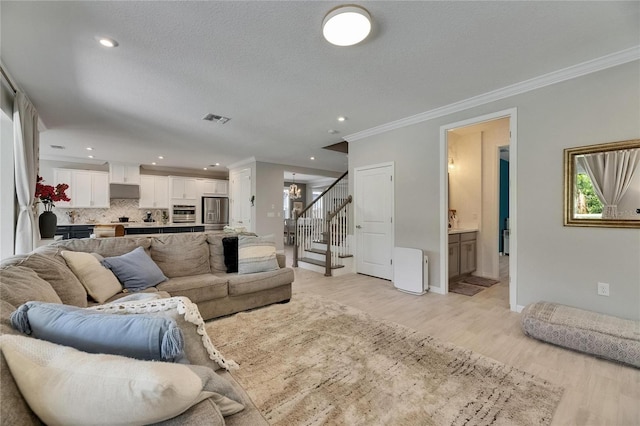 10399 Boyette Brook St, Riverview, FL 33569 - living area with ornamental molding, light wood-style flooring, a chandelier, recessed lighting, and stairs
